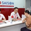 Công nhân, người lao động dẽ dàng vay lãi suất ưu đãi tại HD SAIGON. (Ảnh: Vietnam+)