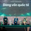 Ông Vương Thành Long-Giám đốc Ban Khách hàng doanh nghiệp nước ngoài của BIDV (ngồi giữa) chia sẻ tại hội nghị. (Ảnh: PV/Vietnam+)