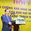 Phó Thống đốc Thường trực Ngân hàng Nhà nước Đào Minh Tú phát biểu tại hội thảo. (Ảnh: PV/Vietnam+)