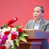 Phó Thống đốc Đoàn Thái Sơn báo cáo tham luận về công tác triển khai Luật các tổ chức tín dụng năm 2024. (Ảnh: Vietnam+)