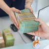 Lợi nhuận ngân hàng tăng nhưng sẽ phân hóa mạnh ở những tháng cuối năm. (Ảnh: Vietnam+)