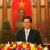 Chủ tịch nước Nguyễn Minh Triết chúc Tết đồng bào, chiến sĩ trong cả nước và kiều bào ở nước ngoài. (Ảnh: Nguyễn Khang/TTXVN)