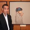 Họa sĩ Nguyễn Thanh Bình tại triển lãm ở Nhật Bản tối 22/4. (Nguồn: Internet)