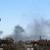Khói bốc lên ở Sanaa sau một cuộc giao tranh. (Nguồn: AFP/TTXVN)