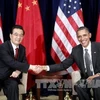 Tổng thống Mỹ Obama và Chủ tịch Trung Quốc Hồ Cẩm Đào bên lề Hội nghị thượng đỉnh (APEC). (Ảnh: THX/TTXVN)