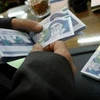 Dân đổ xô mua ngoại tệ gây rối loạn ở thủ đô Tehran