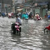 Một tuyến đường ở Thành phố Hồ Chí Minh bị ngập nước. (Ảnh: Tràng Dương/TTXVN).