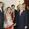 Tổng thống Ấn Độ Pratibha Patil đón tiếp Chủ tịch Quốc hội Nguyễn Phú Trọng. (Ảnh: Trí Dũng/TTXVN).