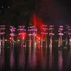 Chương trình nghệ thuật "Hơi thở của nước" được biểu diễn trên sân khấu đặt dưới nước tại Festival Huế 2010. (Ảnh: Nhật Anh/TTXVN).
