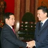 Chủ tịch nước Nguyễn Minh Triết tiếp Chủ tịch Liên đoàn Cờ vua Quốc tế. (Ảnh: Nguyễn Khang/TTXVN).