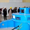 Chủ đầu tư và các chuyên gia kiểm tra thông số kỹ thuật tổ máy phát điện số 1 của Thủy điện Sông Chừng. (Ảnh: Báo Hà Giang)