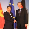 Phó Thủ tướng Bộ trưởng Ngoại giao Phạm Gia Khiêm chụp ảnh với Bộ trưởng Ngoại giao Đức Guido Westerwelle. (Ảnh: Thanh Hải/Vietnam+)