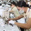 Dệt may là một trong những mặt hàng xuất khẩu chủ lực của Việt Nam sang Mỹ. (Ảnh minh họa: Thanh Vũ/TTXVN)