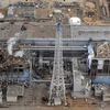 Khói bốc lên từ lò phản ứng số 3 Nhà máy điện hạt nhân Fukushima 1 ngày 20/3. (Ảnh: AFP/TTXVN).