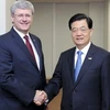 Thủ tướng Canada Stephen Harper và Chủ tịch Trung Quốc Hồ Cẩm Đào tại cuộc gặp ở Vladivostok. (Nguồn: china.org.cn)