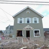 Một ngôi nhà bị hư hại vì bão Sandy. (Nguồn: AFP)