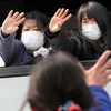 Người dân Nhật Bản đi sơ tán sau sự cố hạt nhân. (Nguồn: Asahi Shimbun/Getty Images)