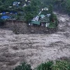 Ngập lụt do mưa lớn ở bang Uttrakhand ngày 17/6. (Ảnh: AFP/TTXVN)