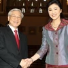 Tổng Bí thư Nguyễn Phú Trọng và Thủ tướng Thái Lan Yingluck Shinawatra. (Ảnh: Trí Dũng/TTXVN)