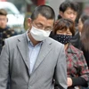 Người dân đeo khẩu trang phòng chống virus cúm gia cầm H7N9 tại Thượng Hải. (Ảnh: AFP/TTXVN)