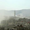 Hình ảnh do phe đối lập Syria công bố, với làn khói trắng được cho là khí gas độc mà quân đội Syria sử dụng ở Damascus (Nguồn: AFP)