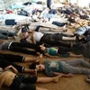 Hình ảnh do phe đối lập Syria cung cấp cho thấy nhiều người đã chết vì hít phải khí độc mà phe này cho là của quân đội chính phủ (Nguồn: Reuters)