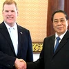Chủ tịch nước Lào Chummaly Saynhasone tiếp Bộ trưởng Ngoại giao Canada. (Ảnh: Hoàng Chương/Vietnam+)