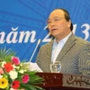 Phó Thủ tướng Nguyễn Xuân Phúc phát biểu tại hội nghị. (Ảnh: Doãn Tấn/TTXVN)