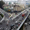 Thông xe cầu vượt bằng thép nút giao thông vòng xoay Cây Gõ. (Ảnh: Hoàng Hải/Vietnam+)