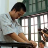 Sát thủ Đặng Trần Hoài tại phiên tòa ngày 25/10 (Ảnh: Sơn Bách/Vietnam+)