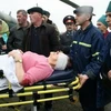 Người bị thương do đánh bom được đưa đến bệnh viện ở Kizlyar. (Nguồn: AP)