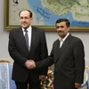 Thủ tướng Iraq Nouri al-Maliki (trái) và Tổng thống Iran Mahmoud Ahmadinejad tại Baghdad ngày 18/10. (Nguồn: AP)