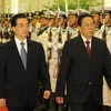 Chủ tịch nước Lào Choummaly Saynasone (phải) và Chủ tịch Trung Quốc Hồ Cẩm Đào. (Nguồn: Xinhua)