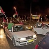Người dân Palestine đổ ra đường phố Jerusalem ngày 23/9. (Nguồn: AP)