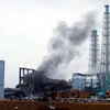 Khói bốc ra từ lò phản ứng số 3 tại nhà máy điện hạt nhân Dai-ichi ở Fukushima ngày 21/3, sau thảm họa động đất và sóng thần. (Ảnh: AFP/TTXVN)