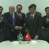 Đại diện Việt Nam và Brazil ký chương trình hành động. (Ảnh: Quang Sơn/Vietnam+)