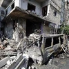 Người dân Syria tại địa điểm xảy ra vụ đánh bom. (Ảnh: AFP/TTXVN)