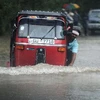 Cảnh ngập lụt trên đường phố ở thủ đô Sri Lanka sau những trận mưa lớn hồi tháng 11. (Ảnh: AFP/TTXVN)