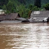 Nước lũ ngập nhà dân ở Sơn Trạch, huyện Bố Trạch, Quảng Bình, trên 1,5m. (Ảnh: TTXVN)