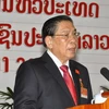 Tổng bí thư Đảng Nhân dân Cách mạng Lào, Chủ tịch nước Lào Choummaly Saysasone đọc báo cáo chính trị tại lễ khai mạc đại hội. (Ảnh: THX/TTXVN)