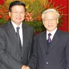 Tổng Bí thư, Chủ tịch Quốc hội tiếp Đặc phái viên của Tổng Bí thư, Chủ tịch nước Lào. (Ảnh: Trí Dũng/TTXVN)