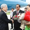 Tổng Bí thư, Chủ tịch Quốc hội Nguyễn Phú Trọng tại sân bay Savanakhet. (Ảnh: Trí Dũng/TTXVN)