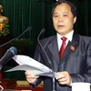 Ông Phan Trung Lý, Ủy viên Ủy ban Thường vụ Quốc hội, Chủ nhiệm Ủy ban Pháp luật của Quốc hội, đọc báo cáo tiếp thu, chỉnh lý dự thảo các luật. (Ảnh: Doãn Tấn/TTXVN)