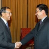 Bộ trưởng Bộ Ngoại giao Phạm Bình Minh tiếp Thứ trưởng Bộ Ngoại giao Lào Bounkeut Sangsomsak. (Ảnh: Dương Giang/TTXVN)