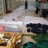 Thi thể các nạn nhân vụ thảm sát tại làng Houla ngày 26/5. (Ảnh: AFP/TTXVN)