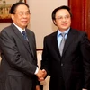 Chủ tịch Chummaly Saynha sone tiếp Trưởng ban Đối ngoại Trung ương Hoàng Bình Quân. (Ảnh: Hoàng Chương/Vietnam+)