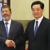 Chủ tịch Trung Quốc Hồ Cẩm Đào và Tổng thống Ai Cập Mohamed Mursi. (Nguồn: xinhuanet)