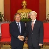 Tổng Bí thư Nguyễn Phú Trọng tiếp ông Phandouangchit Vongsa. (Ảnh: Trí Dũng/TTXVN)