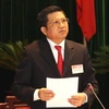 Thống đốc Ngân hàng nhà nước Việt Nam Nguyễn Văn Giàu trả lời chất vấn của đại biểu Quốc hội. (Ảnh: Nguyễn Dân/TTXVN) 