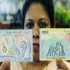 Tờ tiền kỷ niệm mới mệnh giá 1.000 rupi (khoảng 9 USD) của Sri Lanka. (Ảnh: TT&VH)